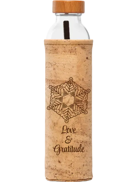 Glass bottle with cork sleeve, wooden lid, snowflake design, and text "Love & Gratitude".