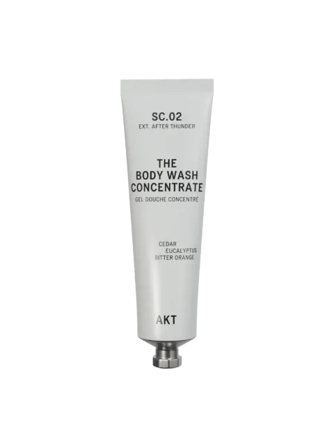 Tube of AKT body wash concentrate with cedar, eucalyptus, and bitter orange.