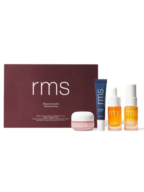 RMS Skincare Secrets Kit with four products in front of a maroon box.
