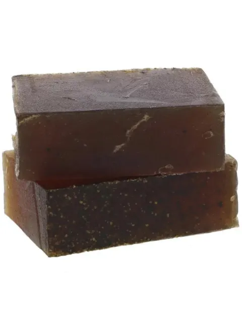 Two stacked bars of dark brown soap with a textured surface.
