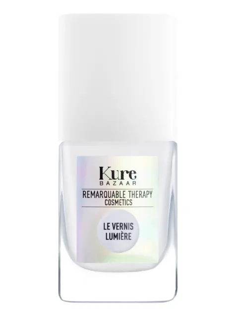 Kure Bazaar nail polish bottle with white cap, label reads "Remarquable Therapy Cosmetics".