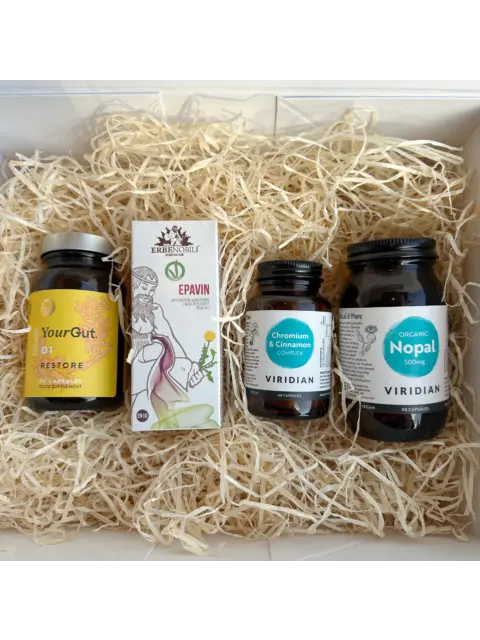 Four supplement bottles on straw bedding: YourGut, Epavin, Chromium & Cinnamon, Organic Nopal.
