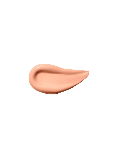 Peach-coloured cream smear on white background.