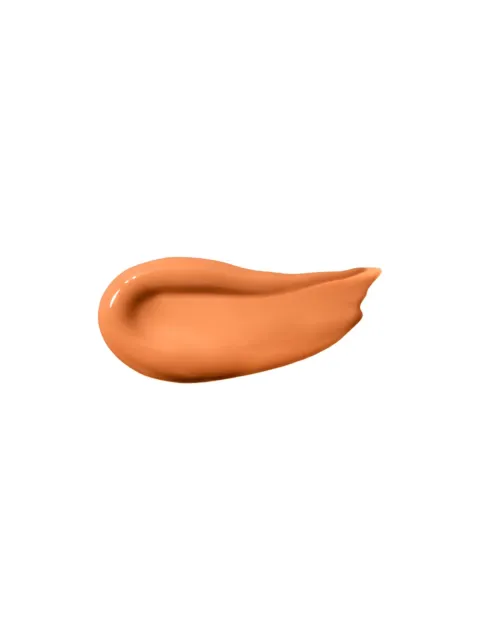 A smear of orange-brown cream on a white background.