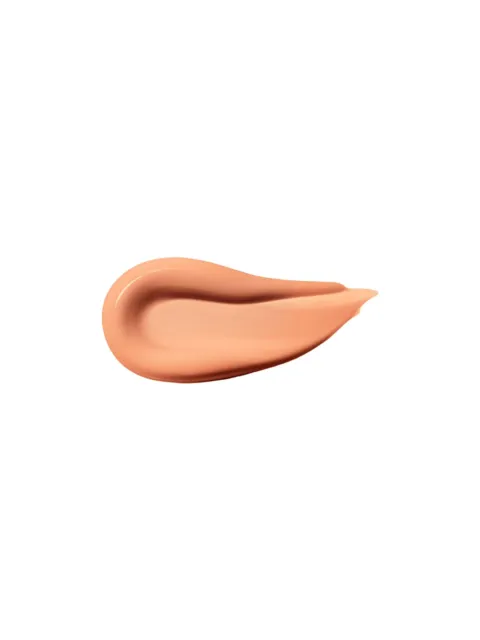 Peach-coloured cream smear on white background.