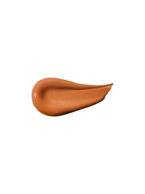 Brown skincare cream smear on white background.