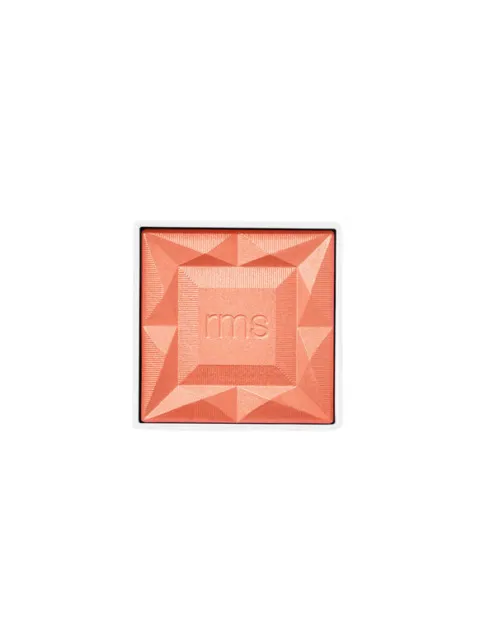 Peach-coloured makeup compact with embossed "rms" logo.