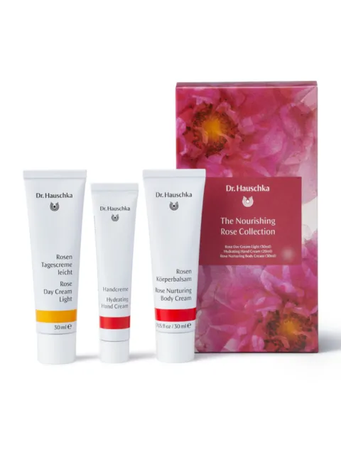 Dr. Hauschka Nourishing Rose Collection with day, hand, and body creams in front of floral box.