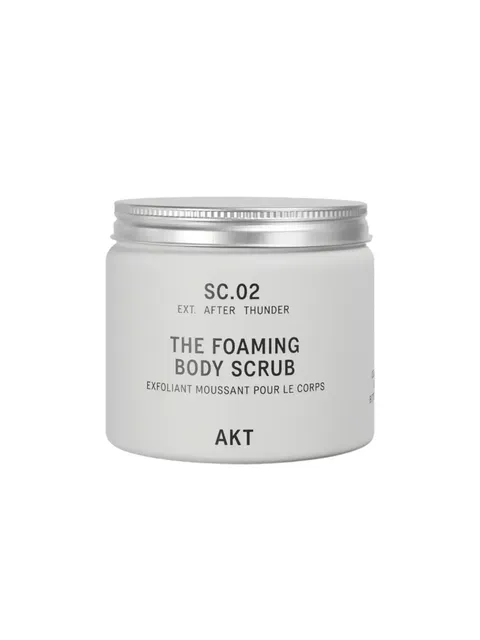 SC.02 Foaming Body Scrub in a white jar with a silver lid.