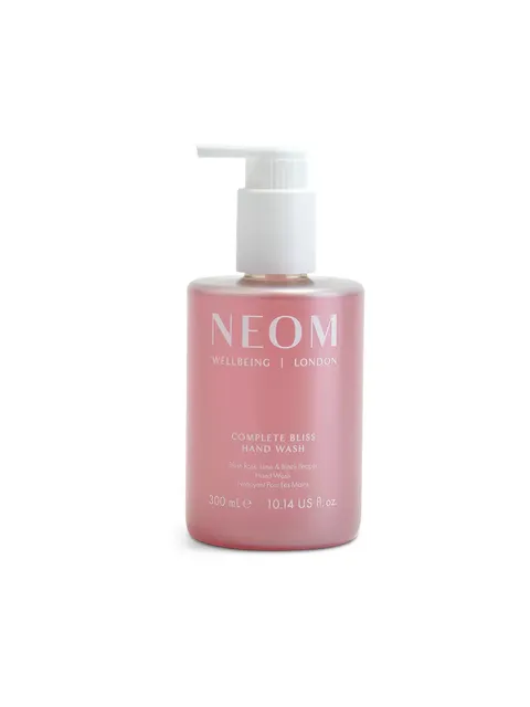 Pink bottle of NEOM Complete Bliss Hand Wash, 300 ml, with pump dispenser.