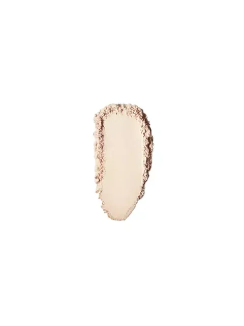 Beige powder swatch with textured edges on a white background.