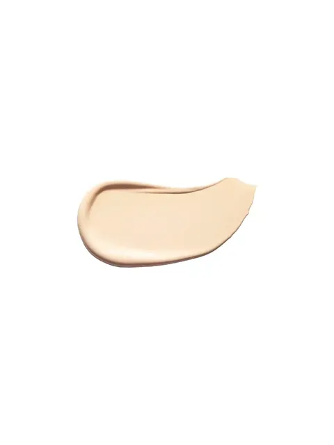 Cream-coloured skincare product smear on white background.