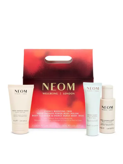 NEOM Wellbeing London gift set with body polish, cleanser, and body milk in red packaging.