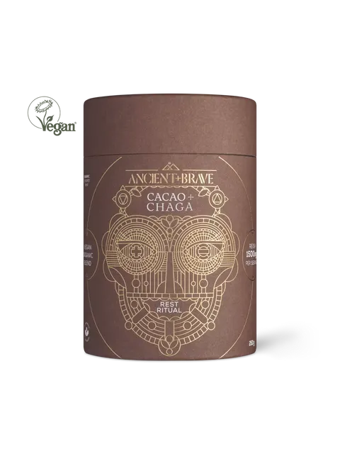 Brown cylindrical container with gold geometric design, labelled "Ancient + Brave Cacao + Chaga".