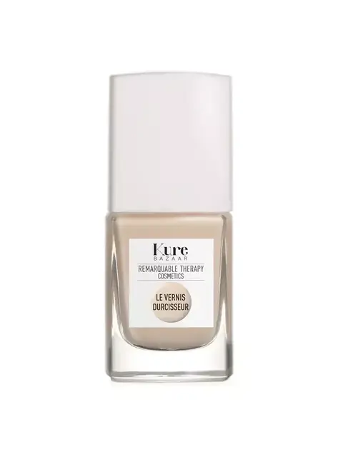 Kure Bazaar nail polish bottle with white cap and beige colour. Label reads "Le Vernis Durcisseur".