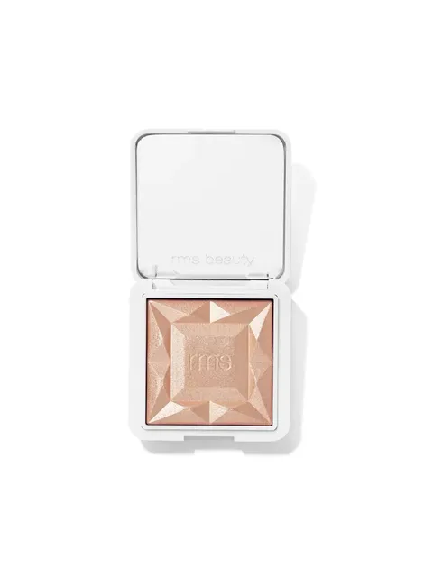 Open compact with embossed peach highlighter and "rms beauty" text.
