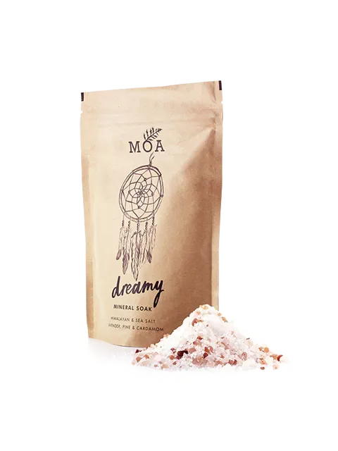 MOA Dreamy Mineral Soak pouch with Himalayan sea salt pile.