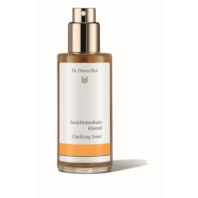 Dr. Hauschka Clarifying Toner bottle with spray top, white and orange label.