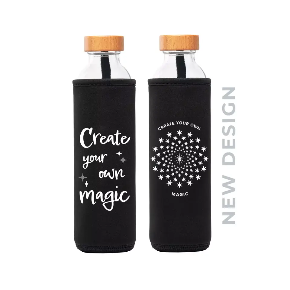 Two glass bottles with black sleeves, wooden lids, and "Create your own magic" text.