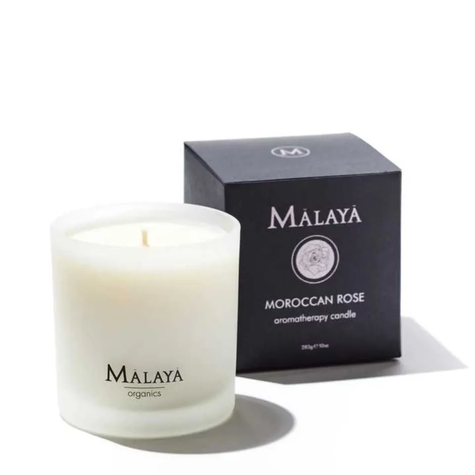 White Malaya organics candle and black box with "Moroccan Rose" text.