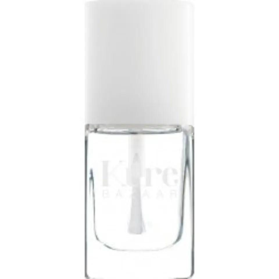 Clear nail polish bottle with white cap, labelled "Kure Bazaar".