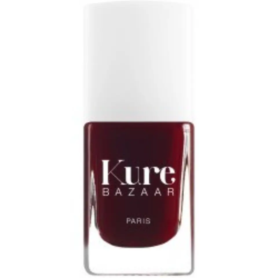 Kure Bazaar nail polish in dark red with white cap.