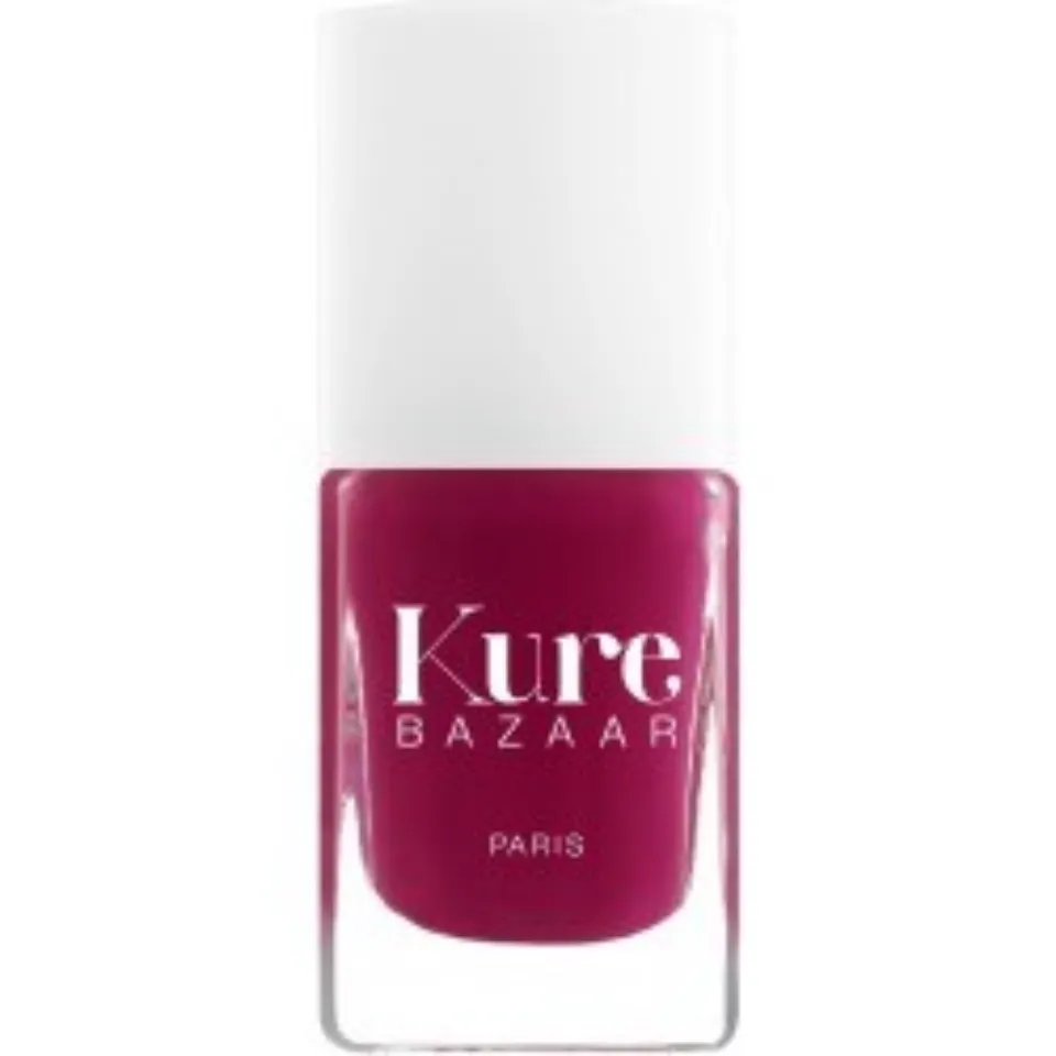Kure Bazaar nail polish in deep pink shade, white cap.