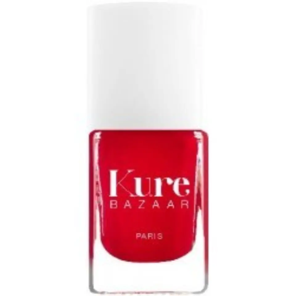 Red nail polish bottle with "Kure Bazaar Paris" text.