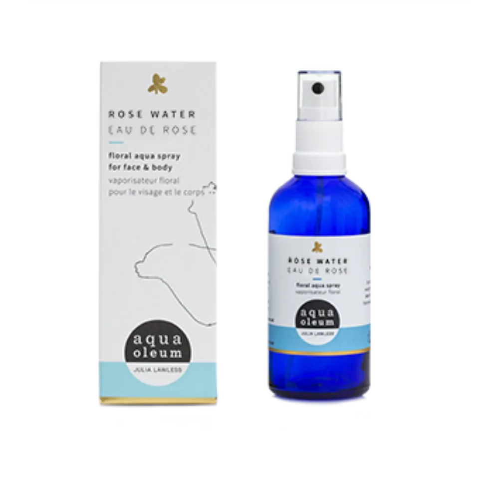 Blue bottle of rose water spray with packaging. Text: "Rose Water Eau de Rose".