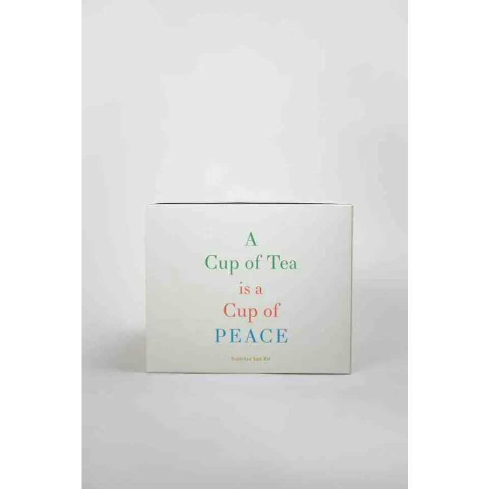 White box with text: "A Cup of Tea is a Cup of Peace".