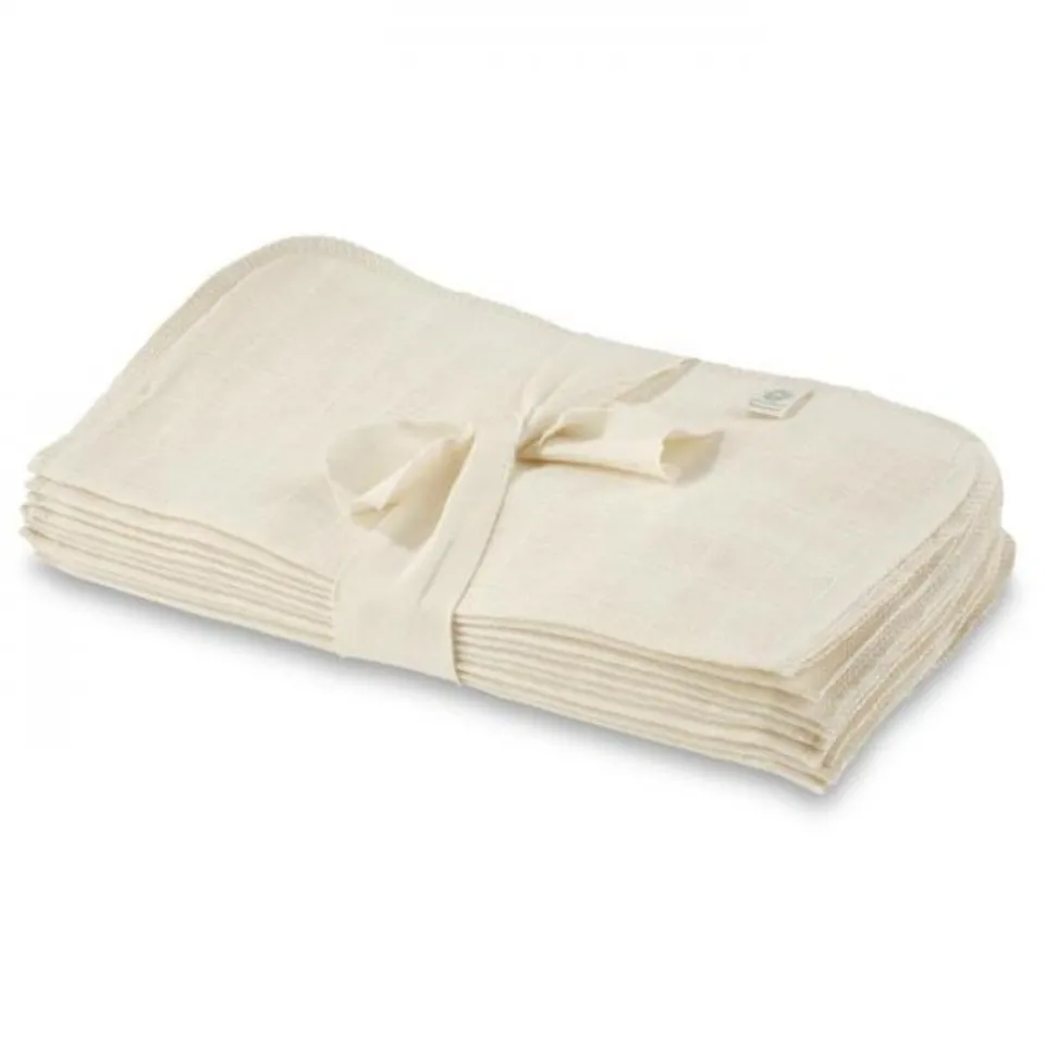 Stack of cream-coloured muslin cloths tied with a ribbon.