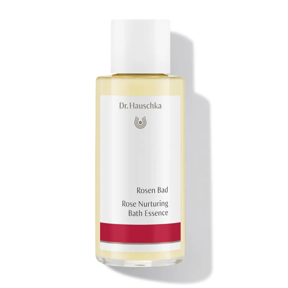 Dr. Hauschka Rose Nurturing Bath Essence bottle with red label.