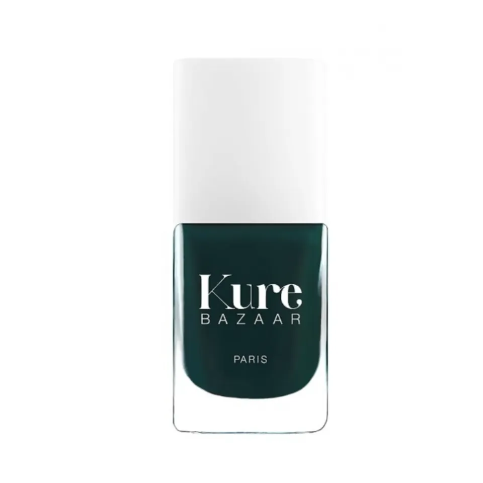 Kure Bazaar nail polish bottle with dark green colour and white cap.