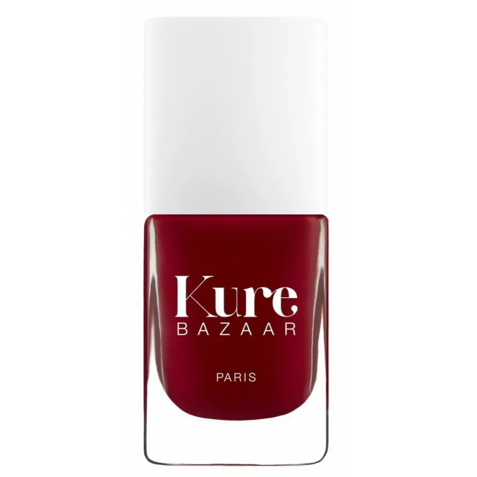 Red nail polish bottle with "Kure Bazaar Paris" text.