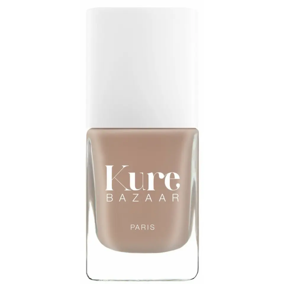 Kure Bazaar nail polish bottle with beige colour and white cap.