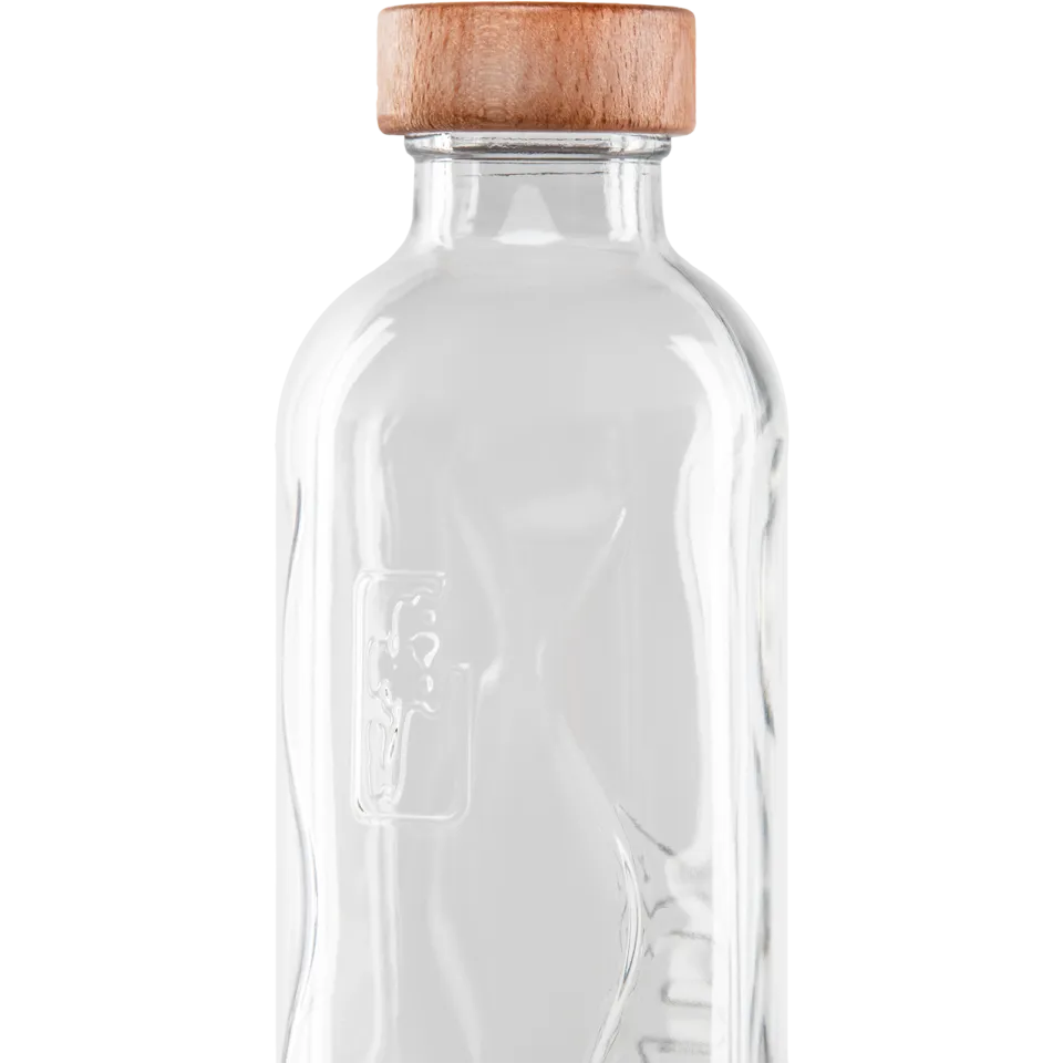 Clear glass bottle with wooden lid, embossed logo on side.