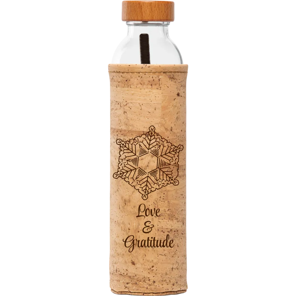 Glass bottle with cork sleeve, wooden lid, snowflake design, and text "Love & Gratitude".
