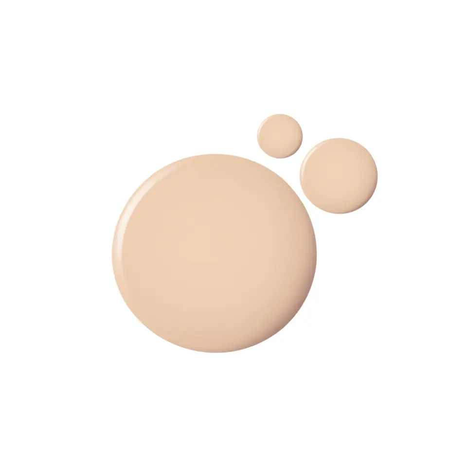 Three beige liquid foundation blobs on a white background.