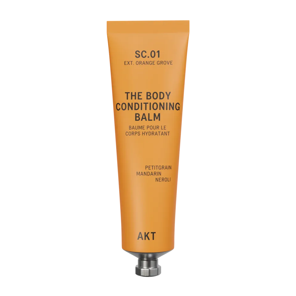 Orange tube labelled "The Body Conditioning Balm" by AKT. Contains petitgrain, mandarin, neroli.