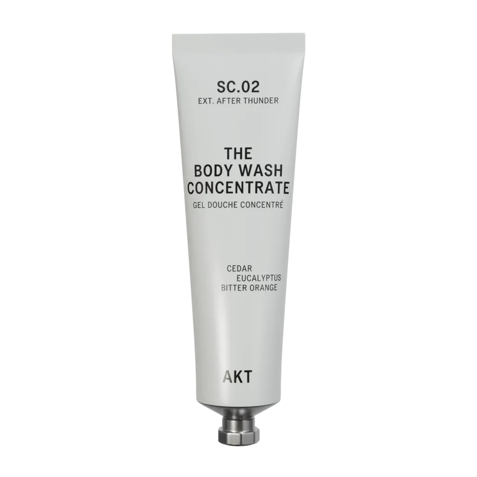 Tube of AKT body wash concentrate with cedar, eucalyptus, and bitter orange.