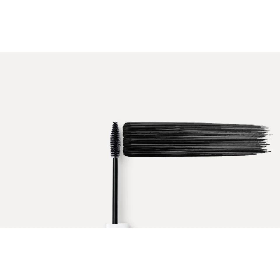 Mascara wand with black mascara stroke on a white background.