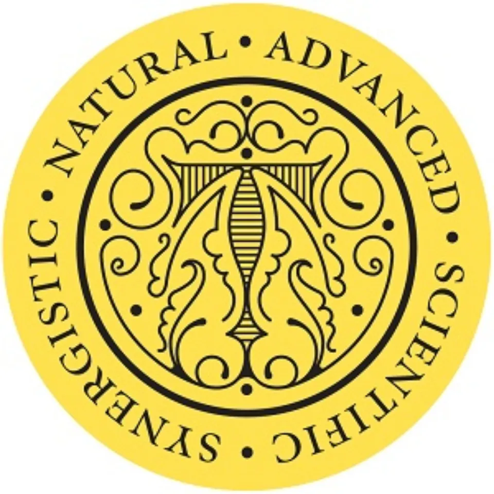 Yellow circular emblem with ornate design. Text: "Natural Advanced Scientific Synergistic".