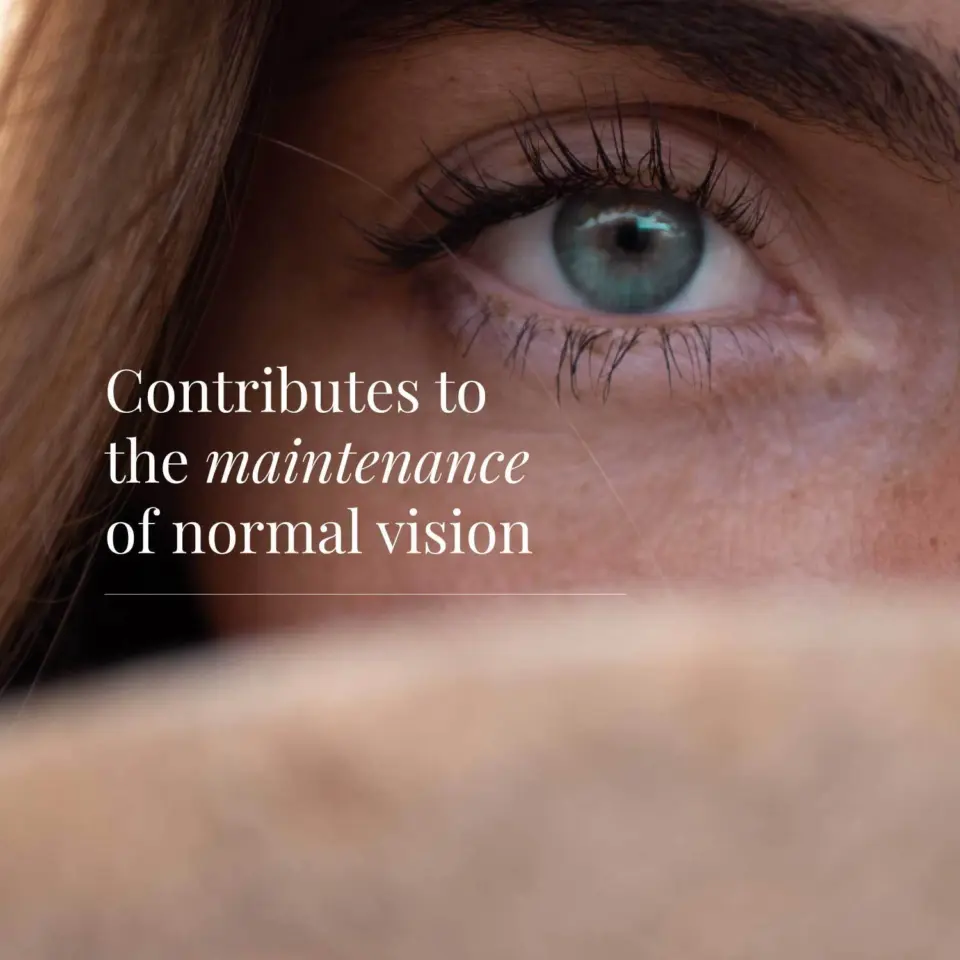 Close-up of a blue eye with text: "Contributes to the maintenance of normal vision".