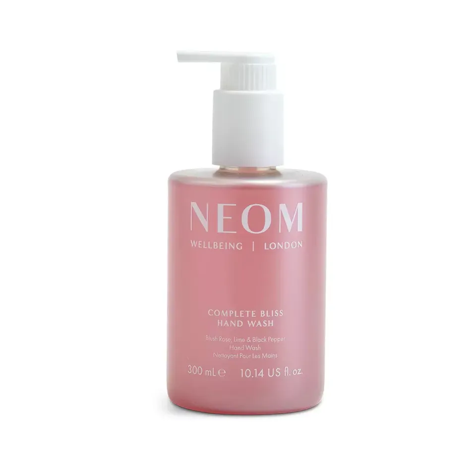 Pink bottle of NEOM Complete Bliss Hand Wash, 300 ml, with pump dispenser.