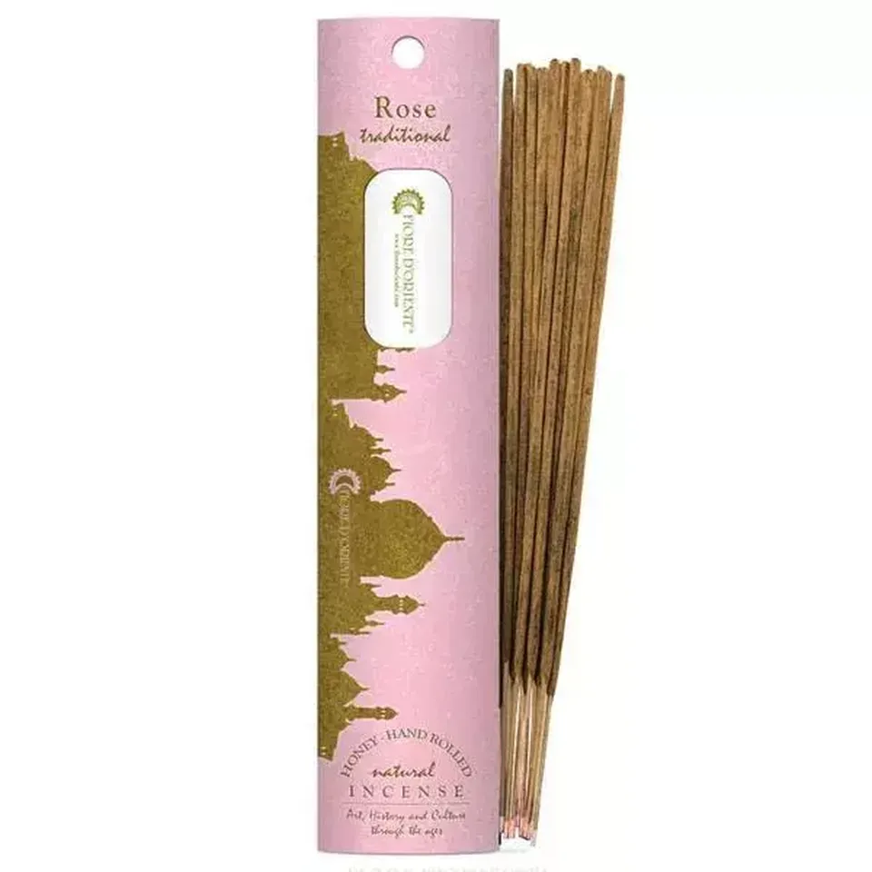 Pink incense packaging with "Rose traditional" text and incense sticks beside it.