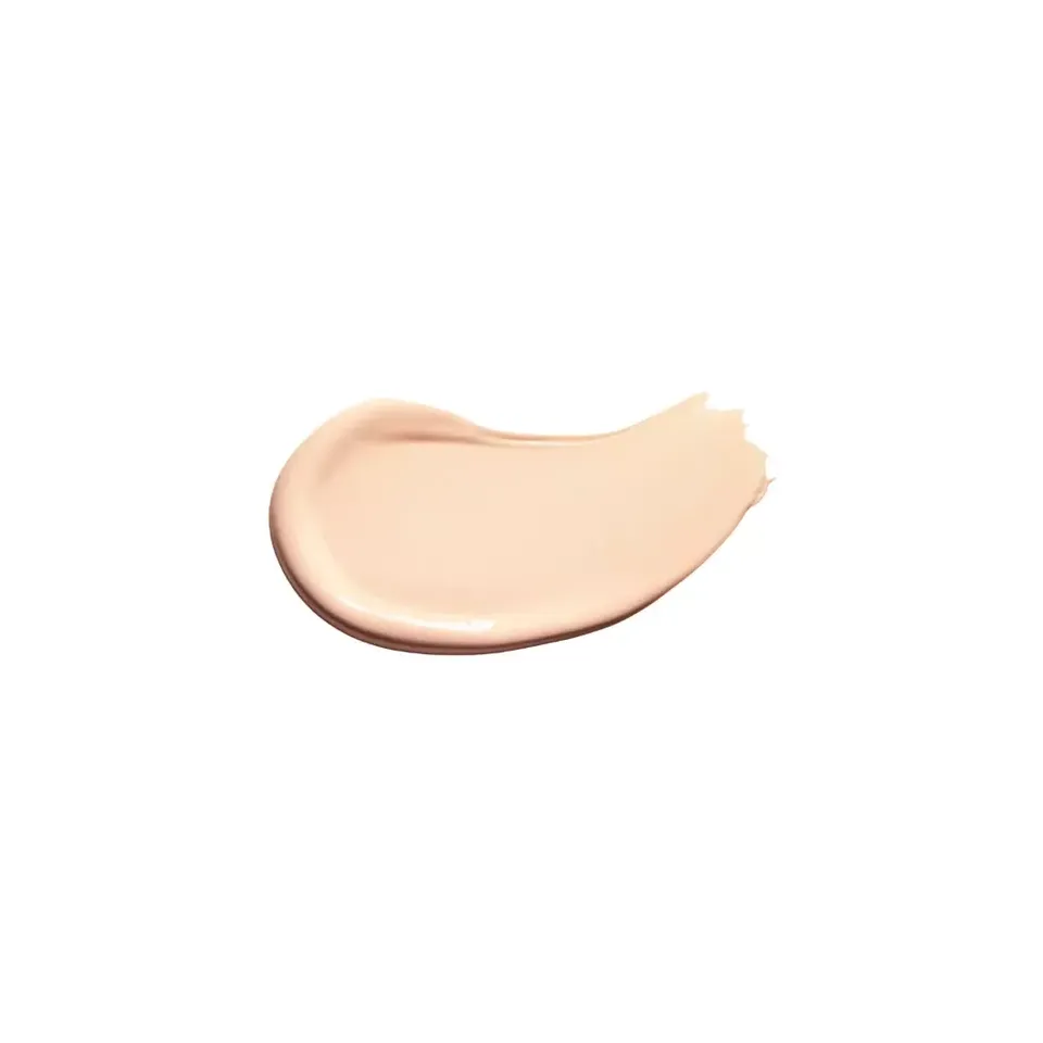 Creamy beige skincare product swatch on white background.