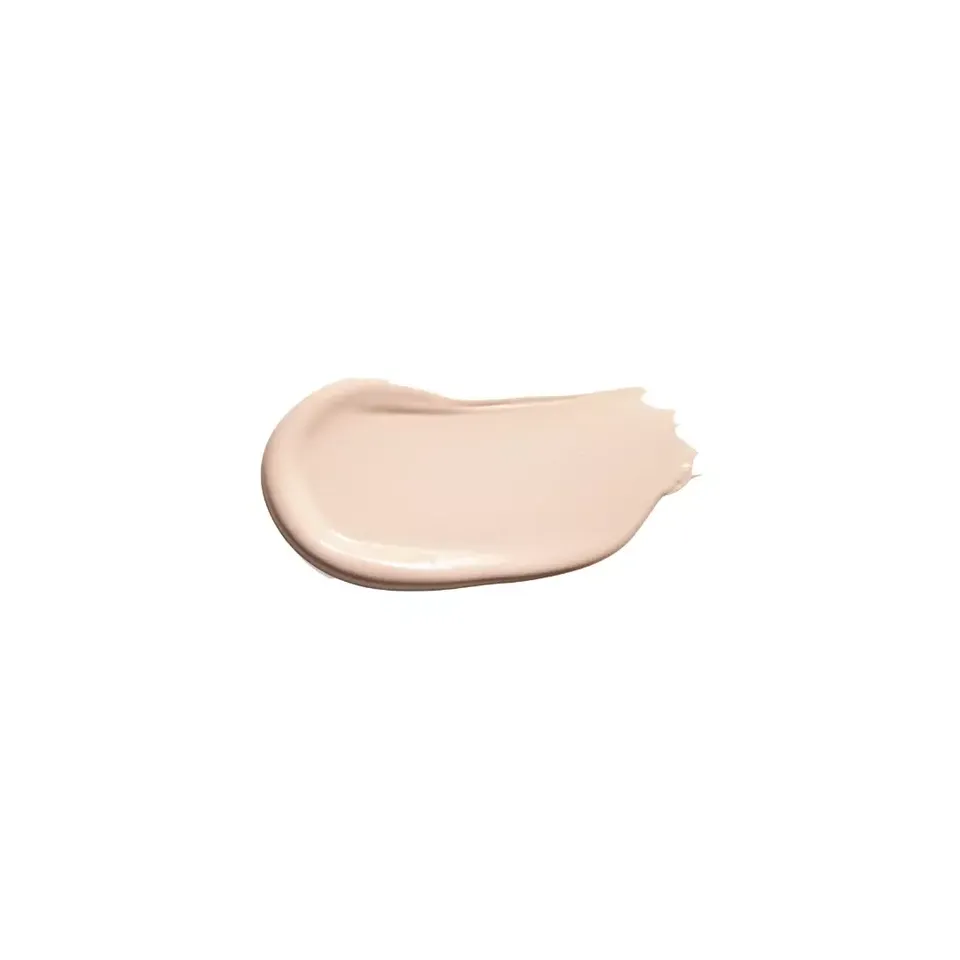 Creamy beige skincare product swatch on white background.