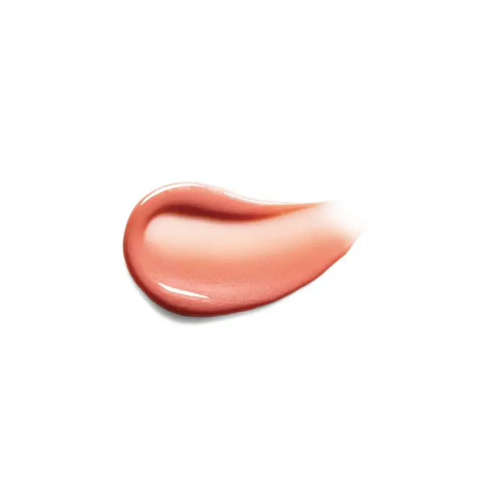 Pink cream smear on white background.