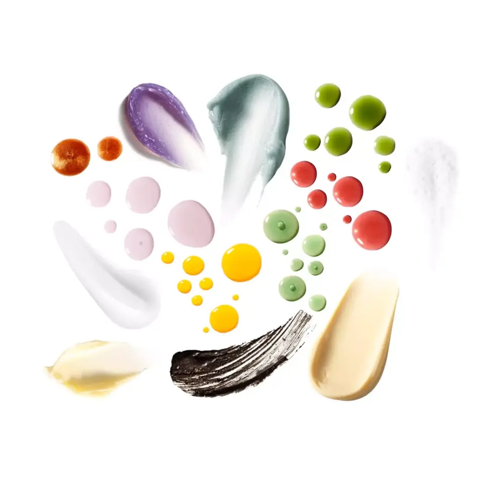 Various skincare product textures in multiple colours on a white background.