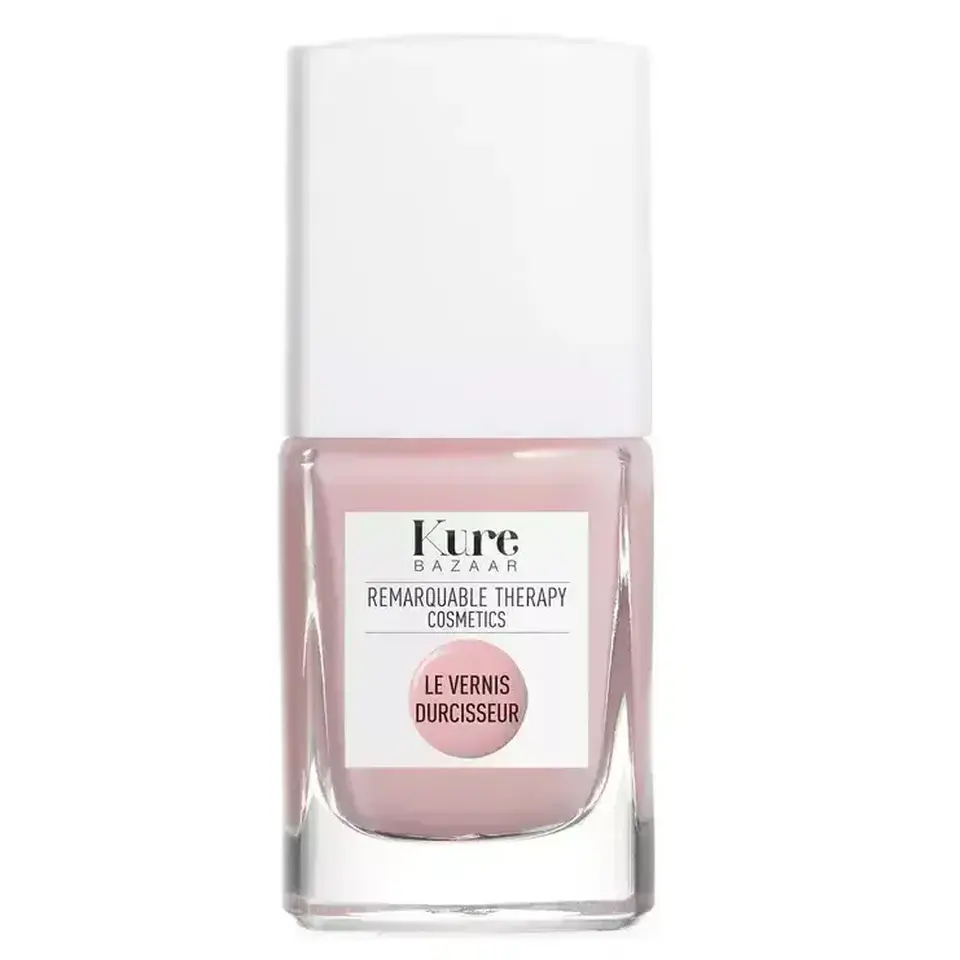 Pink nail polish bottle with white cap, labelled "Kure Bazaar" and "Le Vernis Durcisseur".
